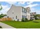 Side view of a gray two-story home with well-maintained lawn and garden at 2267 Kemmerlin St, Johns Island, SC 29455
