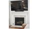 Close-up of a fireplace featuring a white mantel and decorative tile surround at 2267 Kemmerlin St, Johns Island, SC 29455
