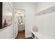 Clean hallway with access to a half bath, coat hooks, and wooden floors at 2267 Kemmerlin St, Johns Island, SC 29455