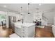 Spacious open kitchen concept with island, white cabinets, and stainless steel appliances at 2267 Kemmerlin St, Johns Island, SC 29455