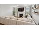Comfortable living room with a fireplace, large TV, neutral tones, and plenty of natural light through the windows at 2267 Kemmerlin St, Johns Island, SC 29455