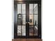 Office featuring black framed french doors, and hardwood flooring at 2267 Kemmerlin St, Johns Island, SC 29455