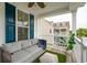 Relaxing outdoor porch with comfortable seating, fan, and neighborhood views at 2267 Kemmerlin St, Johns Island, SC 29455