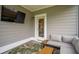 Inviting screened porch with a cozy seating area and stylish rug, perfect for enjoying the outdoors in comfort at 2267 Kemmerlin St, Johns Island, SC 29455