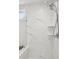 Close up of bright glass enclosed shower with marble tile and shelving at 2267 Kemmerlin St, Johns Island, SC 29455