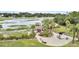 An aerial view showcases the backyard, complete with outdoor seating, a grill, and scenic water views at 250 Little Oak Island Dr, Folly Beach, SC 29439