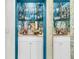 Charming bar featuring copper fixtures, ample mirror, and glassware storage at 250 Little Oak Island Dr, Folly Beach, SC 29439
