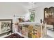 Charming bedroom with a decorative stained glass window and vintage furniture at 250 Little Oak Island Dr, Folly Beach, SC 29439