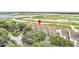 Aerial view of marshfront townhouse complex with mature landscaping at 250 Little Oak Island Dr, Folly Beach, SC 29439