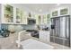 Modern kitchen with stainless steel appliances, marble countertops, and glass-front cabinets at 250 Little Oak Island Dr, Folly Beach, SC 29439