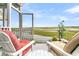 Outdoor porch with chairs overlooking the water, offering a serene view at 250 Little Oak Island Dr, Folly Beach, SC 29439