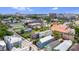 A high aerial view of a neighborhood showcasing houses with green trees and city buildings at 29 Hanover St, Charleston, SC 29403