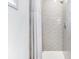 Elegant bathroom with a shower that includes gray subway tile and a honeycomb tile floor at 29 Hanover St, Charleston, SC 29403