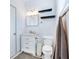 Modern bathroom with a sink, toilet, shelves and window with natural light at 29 Hanover St, Charleston, SC 29403