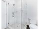 White tiled stand-up shower next to a toilet in a bright and well-lit bathroom at 29 Hanover St, Charleston, SC 29403