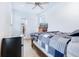 A cozy bedroom featuring natural light, with hardwood floors, a min-fridge, and a closet at 29 Hanover St, Charleston, SC 29403
