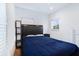 Bedroom featuring a dark headboard and blue bedding, creating a cozy and inviting space at 29 Hanover St, Charleston, SC 29403