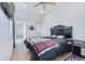 Bedroom with hardwood floors, a ceiling fan, closet and a television creating a comfortable retreat at 29 Hanover St, Charleston, SC 29403