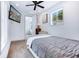 Well-lit bedroom with hardwood floors, closet and a tv providing a comfortable and modern living space at 29 Hanover St, Charleston, SC 29403