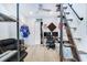 Comfortable bedroom featuring hardwood floors, fan, decor, and an industrial steel staircase at 29 Hanover St, Charleston, SC 29403