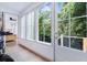 Hallway with ample natural light entering through large windows and a back door at 29 Hanover St, Charleston, SC 29403