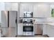 Modern kitchen with stainless steel appliances, sleek white cabinetry, and lots of counter space at 29 Hanover St, Charleston, SC 29403