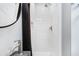 Shower featuring white tiled walls, showerhead, and fixtures at 29 Hanover St, Charleston, SC 29403