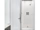 Shower featuring white tiled walls, showerhead, and doorway at 29 Hanover St, Charleston, SC 29403