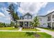 Charming two-story home featuring a covered front porch, well-manicured lawn, and beautiful landscaping at 290 Woodland Oak Way, Summerville, SC 29485