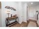Inviting hallway with a decorative table and lighting, featuring hardwood floors at 290 Woodland Oak Way, Summerville, SC 29485