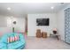 Relaxing living room with a comfortable papasan chair, carpet floors, and a mounted TV at 290 Woodland Oak Way, Summerville, SC 29485