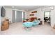 Bright living room with modern blue chairs, wood furniture, and large windows at 290 Woodland Oak Way, Summerville, SC 29485