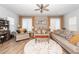 Inviting living room featuring neutral tones, comfortable seating, a ceiling fan, and plenty of natural light at 290 Woodland Oak Way, Summerville, SC 29485