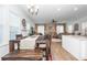 Open-concept living space with hardwood floors, large windows, and a dining area at 290 Woodland Oak Way, Summerville, SC 29485