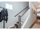 Inviting staircase with neutral tones, wood treads, white risers, and a stylish gray railing at 290 Woodland Oak Way, Summerville, SC 29485