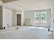 Living room showing natural light from bright windows and featuring walls ready for paint at 3006 Abagail Ct, North Charleston, SC 29406