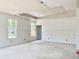 Living room with bright windows and walls ready for paint, awaiting personalization to become home at 3006 Abagail Ct, North Charleston, SC 29406