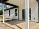New home patio with white columns, dark beams, and ready for outdoor enjoyment at 3006 Abagail Ct, North Charleston, SC 29406