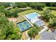 Aerial view of a community with a pool, tennis courts, a playground and lush landscaping near a pond at 3010 Grinnell St, Johns Island, SC 29455