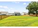 Large grassy backyard with a wooden fence, offering ample space for outdoor activities at 3010 Grinnell St, Johns Island, SC 29455