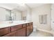 Well-lit bathroom with double vanity, large mirror, and walk-in shower at 3010 Grinnell St, Johns Island, SC 29455