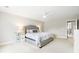 Bedroom with a cozy bed, ceiling fan, and natural light pouring in through a large window at 3010 Grinnell St, Johns Island, SC 29455