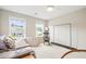 Bright bedroom featuring a daybed, rocking chair, and modern clothing rack at 3010 Grinnell St, Johns Island, SC 29455