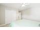 Neutral bedroom with a light green bedspread and double door closet at 3010 Grinnell St, Johns Island, SC 29455