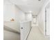 Upstairs hallway featuring neutral walls, carpet, and white doors leading to various rooms at 3010 Grinnell St, Johns Island, SC 29455