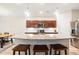 Well-lit kitchen features granite countertops, island seating, and stainless appliances at 3010 Grinnell St, Johns Island, SC 29455