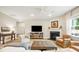 Cozy living room with fireplace and ample natural light at 3010 Grinnell St, Johns Island, SC 29455