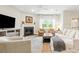 Inviting living room with a fireplace, modern decor, and large windows at 3010 Grinnell St, Johns Island, SC 29455