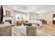 Open-concept living room with fireplace, large windows, and ample seating at 3010 Grinnell St, Johns Island, SC 29455