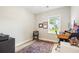 Cozy office with wood floors, a vintage rug, and bright natural light at 3010 Grinnell St, Johns Island, SC 29455